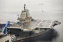 China's first aircraft carrier is seen docked at Dalian Port, in Dalian