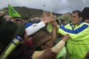 Ecuador's President Rafael Correa greets indigneous Indian supporters during a political rally in Zumbahua