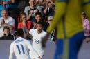 Jesse Lingard of England (C) celebrates with his teammate Nathan Redmond after scoring against Sweden during the UEFA Under-21 European Championship on June 21, 2015