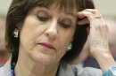 Lerner brushes back her hair before testifying at a House Oversight and Government Reform Committee hearing in Washington