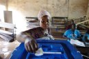 A woman votes during the second round of presidential elections in Bamako