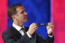 Germany's team manager Oliver Bierhoff holds the lot of Germany during the preliminary draw for the 2018 soccer World Cup in Konstantin Palace in St. Petersburg, Russia, Saturday, July 25, 2015. (AP Photo/Ivan Sekretarev