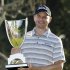 John Merrick holds the winner's trophy after his victory in the Northern Trust Open golf tournament at Riviera Country Club in the Pacific Palisades area of Los Angeles on Sunday, Feb. 17, 2013. (AP Photo/Reed Saxon)