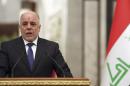 Iraqi Prime Minister Haider al-Abadi speaks at a news conference with Turkey's Prime Minister Ahmet Davutoglu in Baghdad