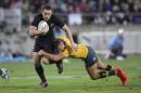 All Blacks Ben Smith, left, is tackled by Australia's Quade Cooper during the Rugby Championship test played at Westpac Stadium in Wellington, New Zealand, Saturday, Aug. 27, 2016. (Mark Mitchell/New Zealand Herald via AP)