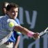 Dimitrov of Bulgaria returns a shot to Djokovic of Serbia at the BNP Paribas Open ATP tennis tournament in Indian Wells, California