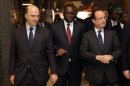 French President Hollande and his Senegalese counterpart Macky Sall arrive at the International Solidarity and Development meeting in Paris