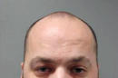 This image provided by Montgomery County Police Department, shows Brian Patrick O'Callaghan. He was charged in the fatal beating of his 3-year-old son who was adopted months earlier from Korea, police said Tuesday, Feb. 18, 2014. Police identified the child as Hyunsu O'Callaghan. (AP Photo/Montgomery County Police)