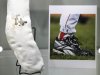 The bloody sock worn by former Boston Red Sox pitcher Curt Schilling in Game 2 of the 2004 World Series is displayed at Heritage Auctions in New York, Thursday, Feb. 21, 2013. Bidding is underway for the sock, which he put up for sale after the high-profile collapse of his video game company. (AP Photo/Seth Wenig)