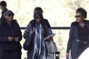 Zenani Mandela, daughter of former South African President Nelson Mandela, arrives with unidentified family members at a Pretoria hospital where Nelson Mandela is being treated