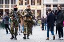 Belgian Army soldiers patrol in the picturesque Grand Place in the center of Brussels on Friday, Nov. 20, 2015. Salah Abdeslam, a French national who lived in Molenbeek, Belgium, is currently the subject of an international manhunt after the Paris attacks. Security has been stepped up in parts of Belgium as a precaution. (AP Photo/Geert Vanden Wijngaert)