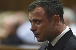 Oscar Pistorius reacts during judgement at the North Gauteng High Court in Pretoria. (REUTERS)