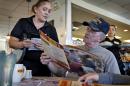 Retired U.S. Navy Vietnam veteran Larry Woodrome, orders a free lunch at Denny's, Tuesday, Nov. 11, 2014 in Gilbert, Ariz. Denny's is giving away free lunches to military veterans on Veteran's Day. (AP Photo/Matt York)