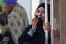 A relative of a supporter of Mohamed Morsi cries outside the courthouse on March 24, 2014 in the central Egyptian city of Minya, after the court ordered the execution of 529 Morsi supporters