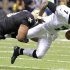 Eagles' Vick is sacked by Saints' Smith during the second half of their NFL football game in New Orleans