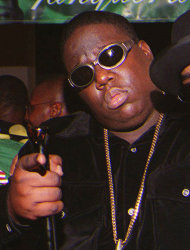 **FILE**In this March 8, 1997 file photo, Notorious B.I.G., whose real name is Christopher Wallace gestures shortly before he was shot to death. Authorities have unsealed an autopsy report the week of Nov. 26, 2012 showing that rapper Notorious B.I.G. was shot four times in a 1997 drive-by shooting that remains unsolved. (AP Photo/Venus Bernardo-Prudhomme, File) ** MANDATORY CREDIT NO SALES **