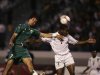 Morocco's Zairi Jaouad fights for the ball with Zimbabwe's Mwanjali Method during their Group 12 African Cup qualifying soccer match at the Mohamed V stadium in Casablanca