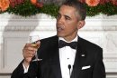 U.S. President Barack Obama makes a toast during the 2013 Governors' Dinner in the State Dining Room of the White House in Washington