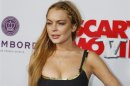 Actress Lindsay Lohan arrives at the premiere of the film "Scary Movie 5" in Hollywood