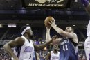 Minnesota Timberwolves forward Kevin Love, right, shoots against Sacramento Kings forward John Salmons, left, during the first quarter of an NBA basketball game in Sacramento, Calif., Tuesday, Nov. 27, 2012.(AP Photo/Rich Pedroncelli)