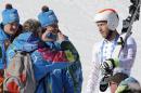 United States' Bode Miller talks to Olympic staff after a men's downhill training run for the Sochi 2014 Winter Olympics, Saturday, Feb. 8, 2014, in Krasnaya Polyana, Russia. the 2014 Winter Olympics, Saturday, Feb. 8, 2014, in Krasnaya Polyana, Russia. (AP Photo/Christophe Ena)
