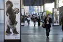 Man walks by advertisement for Corning Gorilla Glass 3 outside Las Vegas Convention Center on first day of Consumer Electronics Show in Las Vegas in this file photo