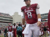 In this photo taken Sept. 15, 2012, Arkansas quarterback Tyler Wilson (8) walks from the field after Arkansas' 52-0 loss to Alabama in an NCAA college football game in Fayetteville, Ark. Wilson could not play in the game because of a head injury suffered against Louisiana-Monroe on Sept. 8, and will not play until cleared by doctors to return. (AP Photo/Danny Johnston)