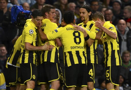 Borussia Dortmund's players celebrate the goal of Marco Reus against Manchester City during their Champions League Group D soccer match in Manchester