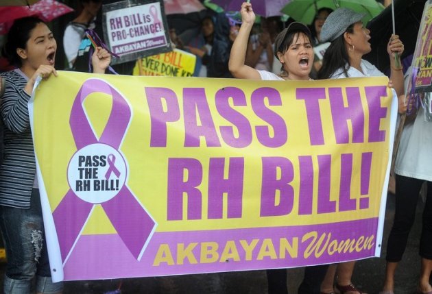 People rally outside congress in Manila on August 6, 2012 for the passage of the Reproductive Health Bill. Philippine legislators were Monday poised to pass landmark birth control laws, despite lobbying by the Catholic church, the bill's author said