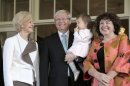 Governor-General Quentin Bryce, left, poses with newly commissioned Australian Prime Minister Kevin Rudd, second from left, his wife Therese Rein, right, and his granddaughter Josephine Tse, at Government House in Canberra, Australia, Thursday, June 27, 2013. Rudd was sworn in as prime minister three years and three days after he was ousted from the same job in an internal government showdown. (AP Photo/Rick Rycroft)