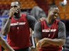Miami Heat small forward LeBron James, left, and shooting guard Dwyane Wade joke during practice, Wednesday, June 20, 2012, in Miami. The Heat play Game 5 against the Oklahoma City Thunder on Thursday. (AP Photo/Alan Diaz)