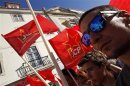 Communist Party members march during a protest calling for a government resignation in Lisbon