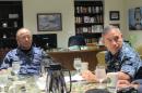 Japanese navy commander Adm. Katsutoshi Kawano, left, and U.S. Pacific Fleet commander Adm. Harry Harris listen to a reporter's question in Pearl Harbor, Hawaii on Monday, July 14, 2014. The admirals, meeting on the sidelines of the world's largest maritime exercises, say cooperation between their two navies is deepening. (AP Photo/Audrey McAvoy)