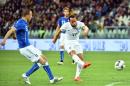 England's midfielder Andros Townsend (R) shoots to score a goal during the friendly football match Italy vs England at the Juventus Stadium in Turin on March 31, 2015