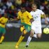South Africa's Dkgacoi is challenged by Algeria's Guedioura during their international friendly soccer match in Soweto