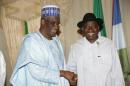 Haliru Mohammed Bello, pictured on April 19, 2011 with Nigerian President Goodluck Jonathan, has been charged with corruption