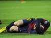 Barcelona's Lionel Messi reacts after picking up an injury while trying to score a goal against Benfica's goalkeeper Artur during their Champions League Group G soccer match at the Nou Camp stadium in Barcelona