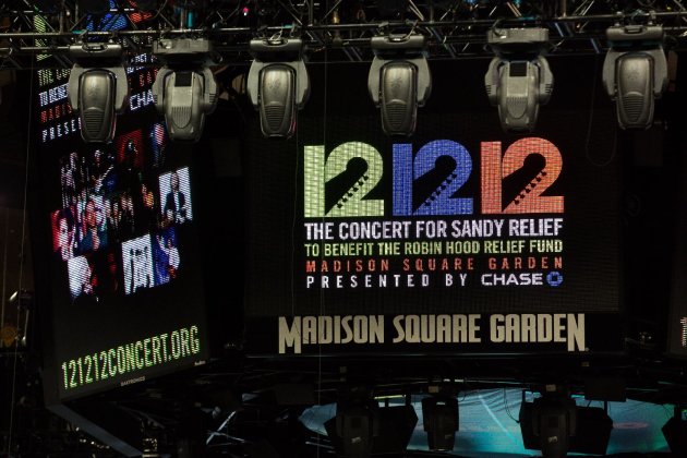 Signage for the "12-12-12" concert is displayed on the Madison Square Garden jumbotron, Tuesday, Dec. 11, 2012, in New York. The Dec. 12 concert, whose proceeds will aid victims of Superstorm Sandy, will feature artists Bon Jovi, Eric Clapton, Dave Grohl, Billy Joel, Alicia Keys, Chris Martin, The Rolling Stones, Bruce Springsteen & the E Street Band, Eddie Vedder, Roger Waters, Kanye West, The Who and Paul McCartney. (AP Photo/John Minchillo)