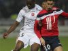 Valenciennes's Ifimat Mirin fights for the ball with Lille's Hazard during their French Ligue 1 soccer match at Stadium Villeneuve d'Ascq