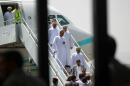 Representatives from the Omani government disembark Royal Air Force of Oman plane at Sanaa International airport, as three Americans, two Saudis and a Briton are to travel to Muscat after they were released by Shiite Huthi rebels, September 20, 2015