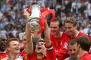 Liverpool captain Steven Gerrard (C, lifting trophy) almost single-handedly won the 2006 FA Cup for Rafael Benitez's team