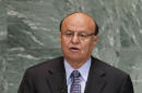 This Sept. 26, 2012, file photo shows Abed Rabbo Mansour Hadi, President of Yemen, as he addresses the 67th United Nations General Assembly, at U.N. headquarters. Witnesses say rebel Houthi militiamen are battling soldiers near Yemen's presidential palace. The status of President Hadi was not immediately clear.The battle began early Monday, Jan. 19, 2015. Witnesses say they heard heavy machine gun fire and mortars falling in the neighborhood. Civilians in the area fled the fighting. (AP Photo/Jason DeCrow, File)