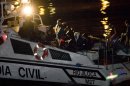 La Guardia Civil traslada al puerto de Almería a 21 inmigrantes de origen argelino, entre ellos dos menores, tras rescatarlos de una patera que ha sido interceptada hoy frente a las costas de Almería. EFE