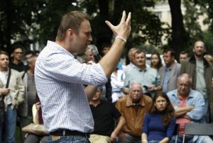 Russia's opposition leader and anti-graft blogger Navalny gestures as he speaks in Moscow