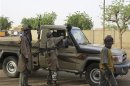 Fighters from MUJWA ride on a truck in the northeastern Malian city of Gao