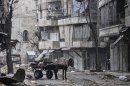 This Monday, Dec. 17, 2012 photo, shows damaged buildings due to heavy clashes between Free Syrian Army fighters and government forces in the Karmal Jabl neighborhood in Aleppo, Syria. (AP Photo/Narciso Contreras)
