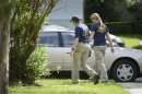 FBI personnel walk through the complex surrounding the apartment, where Ibragim Todashev was shot and killed by FBI, in Orlando