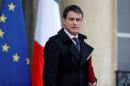 French Prime Minister Manuel Valls leaves after he attended a defence council at the Elysee Palace in Paris