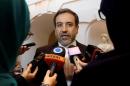 Iran's top nuclear negotiator Araqchi talks to journalists after meeting senior officials from the United States, Russia, China, Britain, Germany and France in a hotel in Vienna