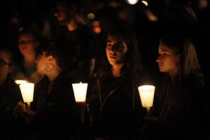 People take part in candle light vigil following a mass shooting at Umpqua Community College in Roseburg Oregon